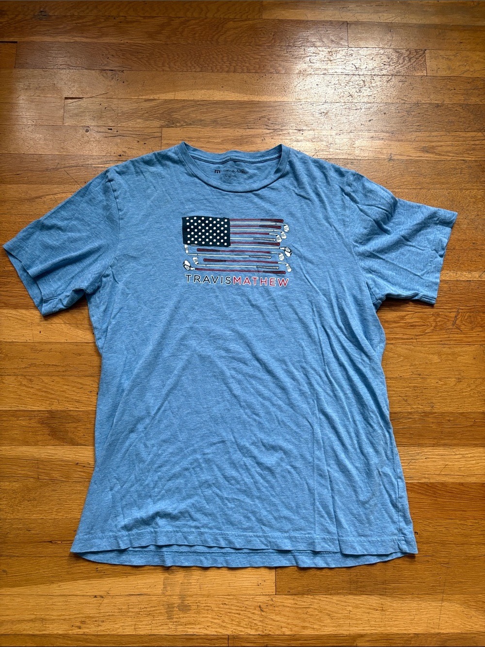 Blue Travis Mathew Golf Club Flag Graphic Tee.  Size Large